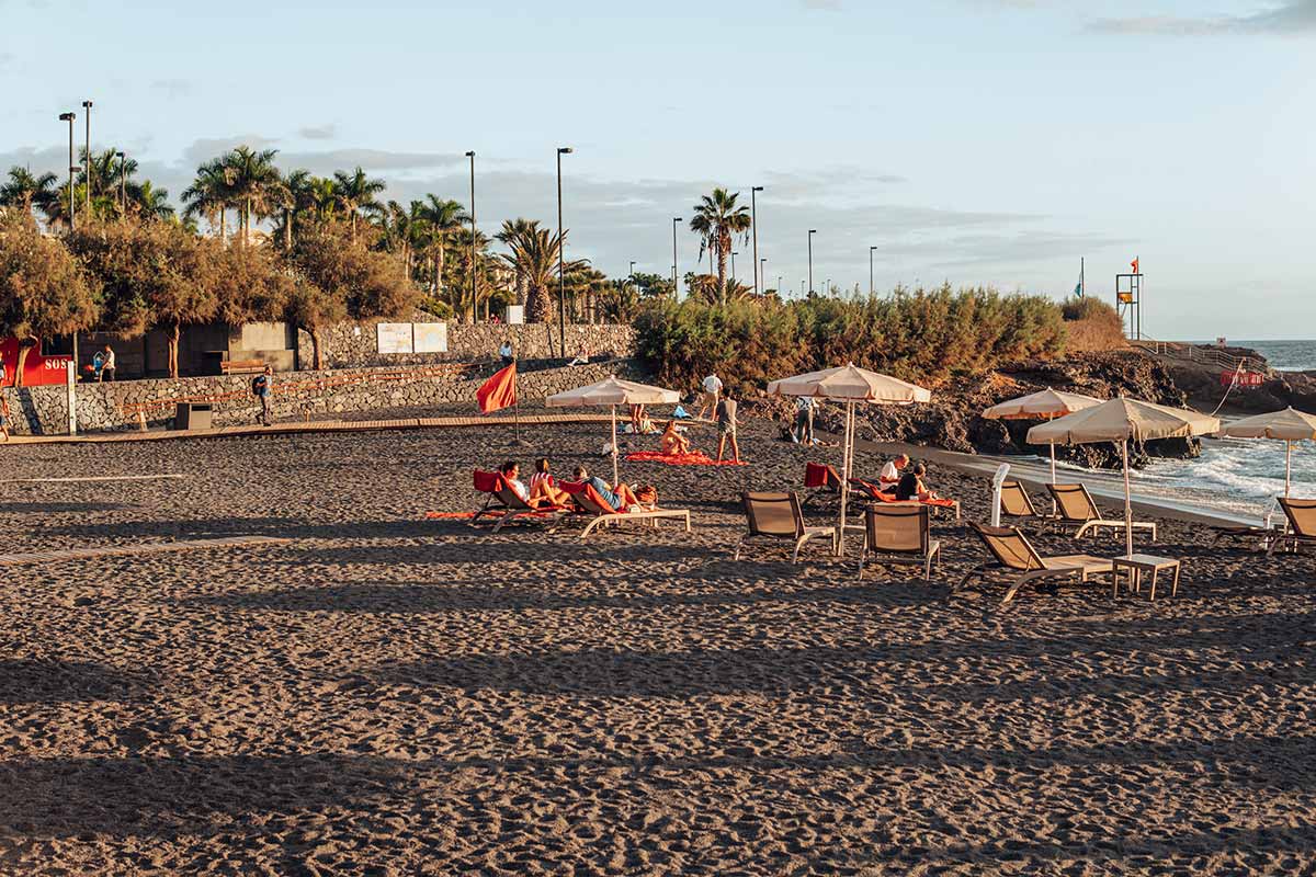 Sunset at black sand beach Playa la Jaquita in Alcala 