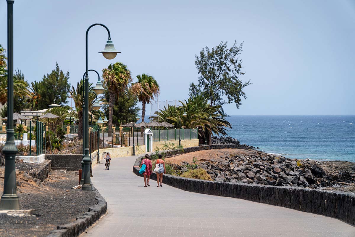 People walking along the promenade in Costa Teguise, Lanzarote